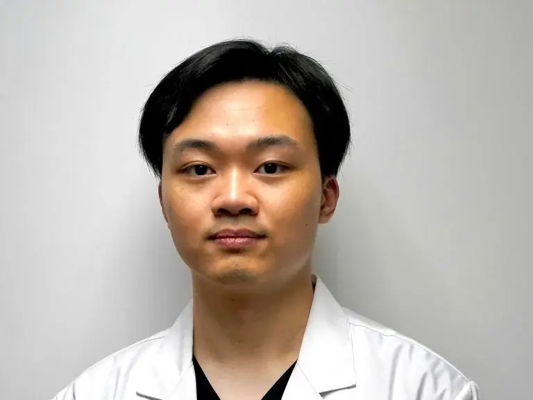 Dr. Lui Kwan Long, Registered Chiropractor, at the Causeway Bay clinic